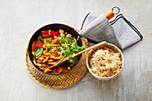 Colorful vegetable wok with almonds