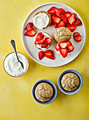 Breakfast scones with oats and chia served with quark and strawberries