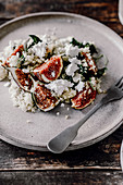 Salad with millet, cottage cheese, spinach and figs