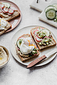 Sandwiches with hummus egg radish and cucumber