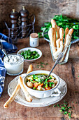 Vegetable soup with bread sticks