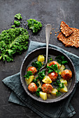 Potato and kale stew with dumplings