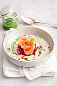 Horseradish foam soup with beetroot tartare and a salmon rose