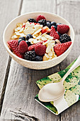 Californian porridge with fresh berries and flaked almonds