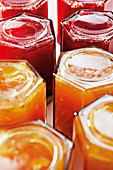 Turning freshly made jam upside down in jars