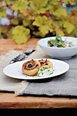 Puff pastry snail with wild boar