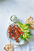 Pork souvlaki with red peppers