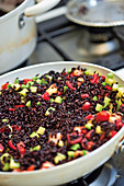 Riso venere (black rice with with zucchini and tomatoes, Italy)