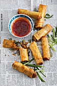 Spring rolls filled with fried chicken, rice and vegetables