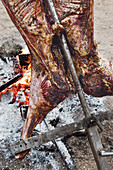 Asado – a whole lamb being grilled on a spit