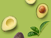Halved avocados on a green surface