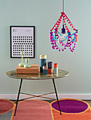A DIY hanging lamp with vintage pompoms and tassels