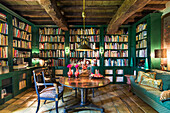 Library with green accents and rustic wooden beams