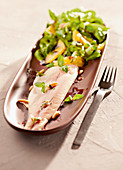 Lamb's lettuce with oranges and trout fillets