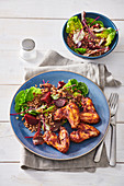 Spicy chicken wings with warm autumn salad