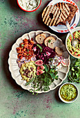 Various dips with herbs and grilled bread