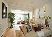 Elegant living room with panelled walls and stucco ceiling