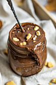 Closeup of Homemade Vegan Chocolate Hazelnut Spread with Cookies