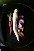 An assortment of red, white, Japanese, daikon radishes
