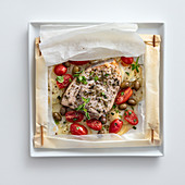 Swordfish with potatoes, date tomatoes and olives