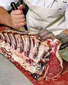 Cutting porterhouse steaks
