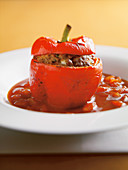 A pepper stuffed with minced meat in tomato sauce