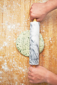 Herb pastry being rolled out
