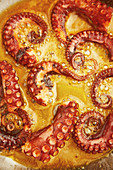 Octopus being fried in pepper butter