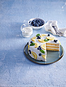 Cream cake with blueberries and lemons