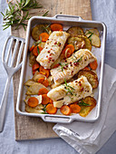 Cod baked with celery, carrots and potatoes