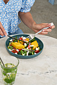 Polenta salad with pepper, cucumber and feta cheese