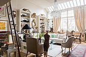 1920s chandelier in drawing room of apartment filled with antique collectables