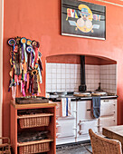 A collection of rosettes adorn a pinboard in a country kitchen