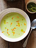 Cream of pea soup with flower petals