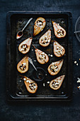Oven-baked pear halves filled with almond flakes