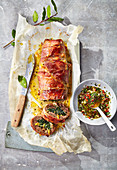 Minced meat and cheese roulade wrapped in bacon