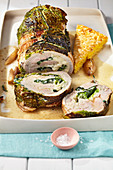 Turkey roulade filled with Savoy cabbage, served with polenta slices and a cider sauce