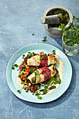 Plaice rolls on a bed of saffron and shallot lentils