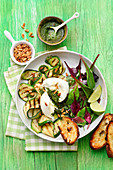 Grilled zucchini with mozzarella and young Swiss chard and pine nuts