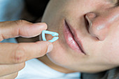 Woman using a nasal clip