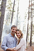 Portrait of smiling couple in woods