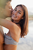 Close up portrait of couple kissing