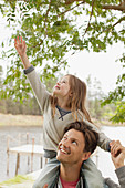 Daughter on father's shoulders