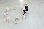 Portrait of smiling businessman sitting