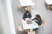 Businessman and businesswoman at cafe