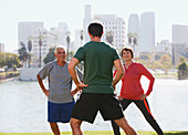Older couple exercising with trainer