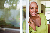 Older woman smiling in doorway