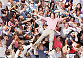 Portrait of man crowd surfing