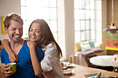 Couple hugging in kitchen