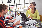 Couple working together at desk